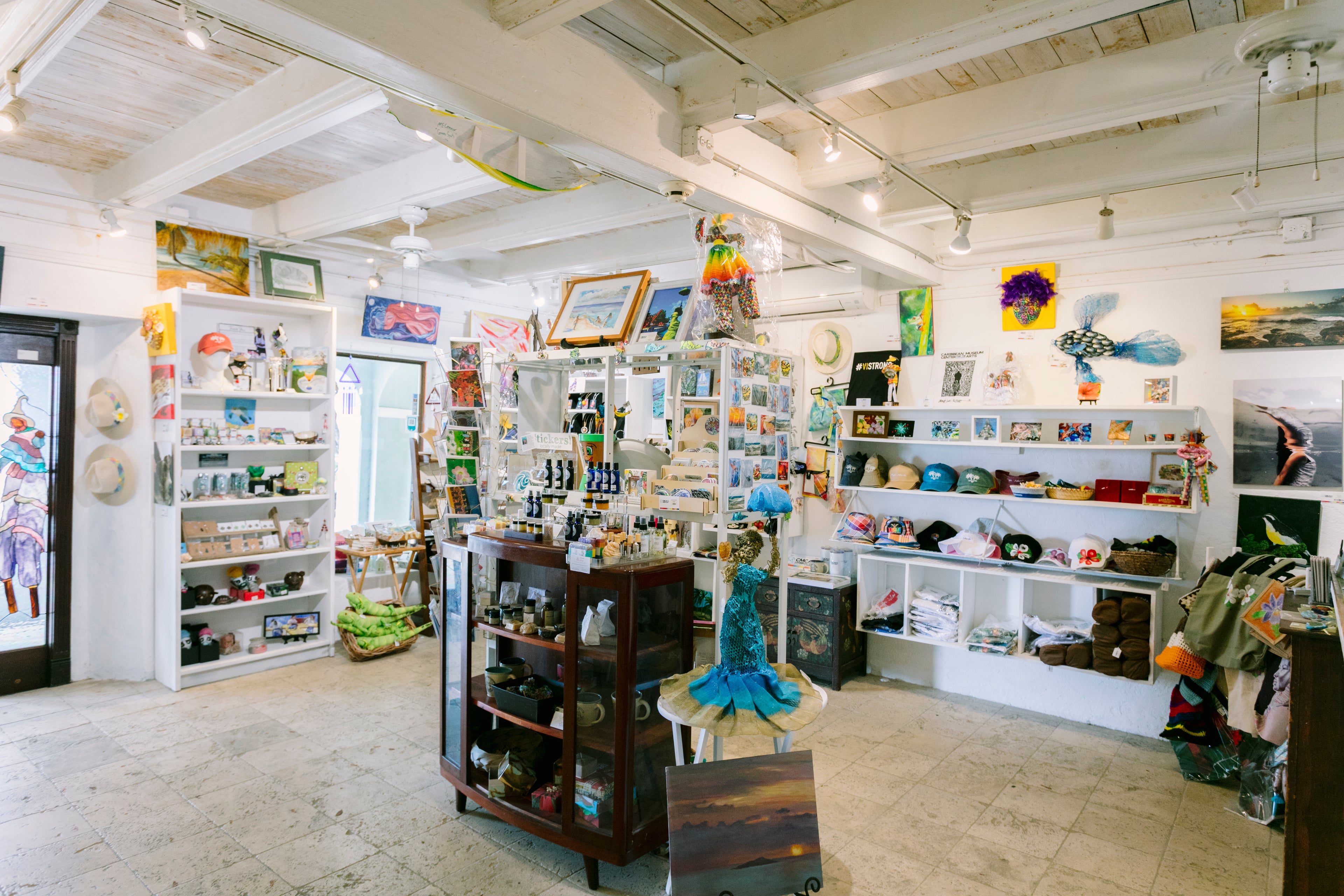 Store interior with various products on shelves and display cases.